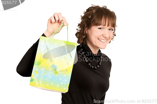 Image of smiling girl buyer with present bag