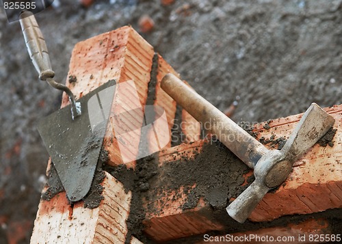 Image of bricklayer equipment trowel and hack