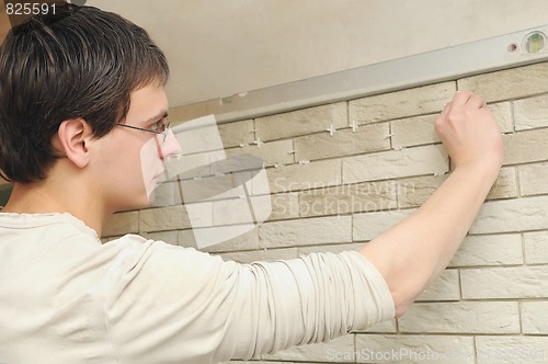 Image of worker tiler at work