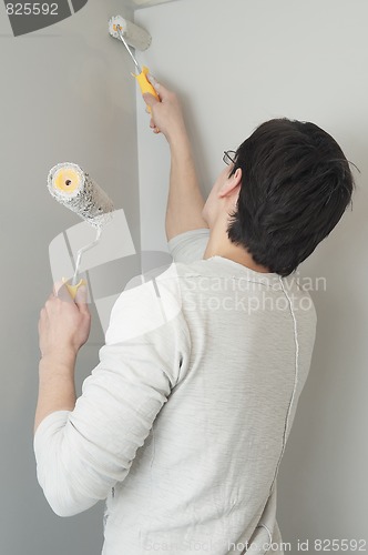 Image of Painter worker with two rollers