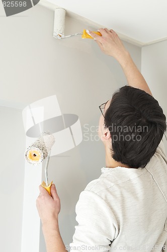 Image of Painter worker with two rollers