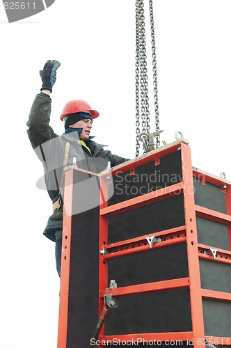 Image of worker builder and concrete formwork