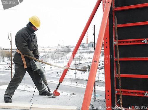 Image of worker builder and concrete formwork