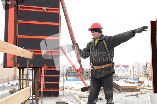 Image of worker builder and concrete formwork