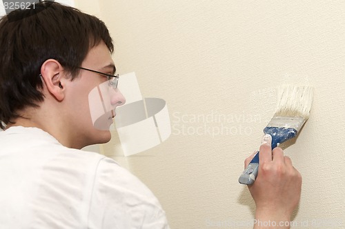 Image of Painter worker decorator with brush