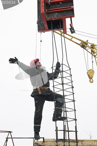 Image of worker builder installing a concrete formwork