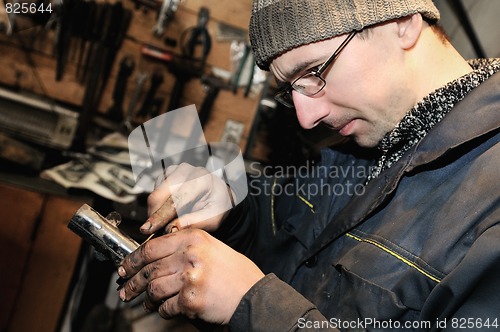 Image of car mechanic at repair work