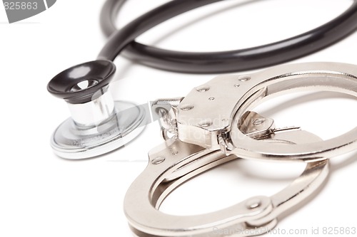 Image of Stethoscope and Handcuffs on White