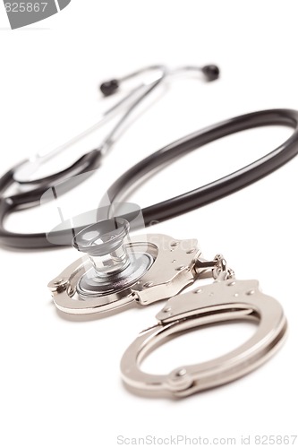 Image of Stethoscope and Handcuffs on White