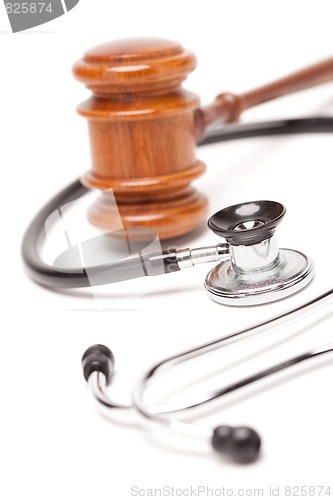 Image of Black Stethoscope and Gavel on White