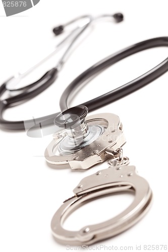 Image of Stethoscope and Handcuffs on White