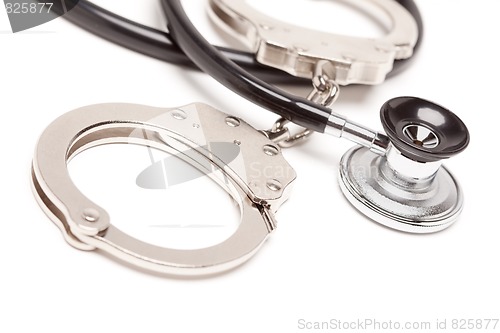 Image of Stethoscope and Handcuffs on White