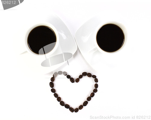 Image of Coffee beans and two cup of coffee