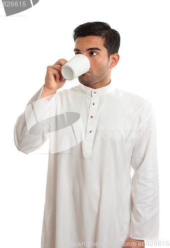Image of Arab man drinking coffee