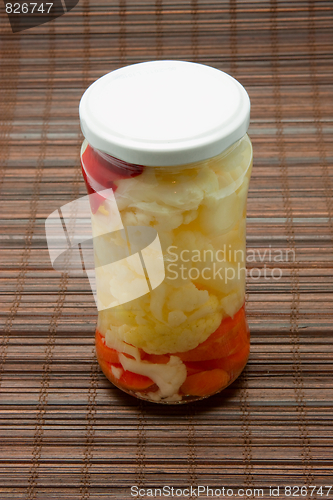 Image of Glas jars with marinated vegetables  isolated on the white backg