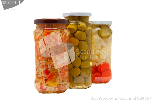 Image of Glass jars with marinated vegetables  isolated on the white back