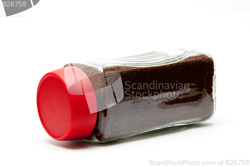 Image of coffee in a glass jar under the white background