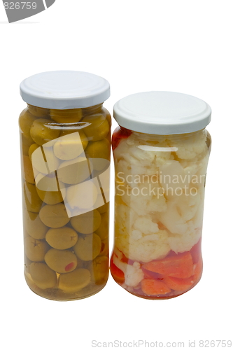 Image of Glass jars with marinated vegetables  isolated on the white back