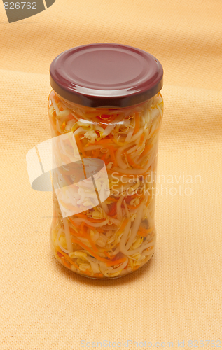 Image of Glas jars with marinated vegetables  isolated on the white backg