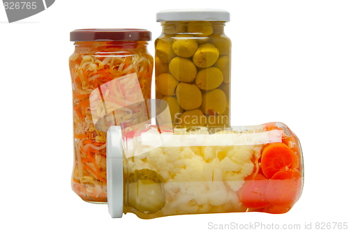 Image of Glass jars with marinated vegetables  isolated on the white back