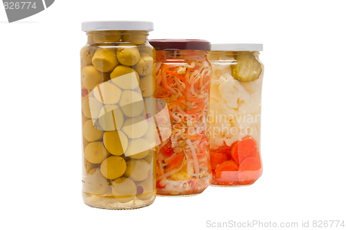 Image of Glass jars with marinated vegetables  isolated on the white back