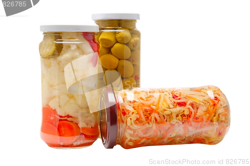 Image of Glass jars with marinated vegetables  isolated on the white back