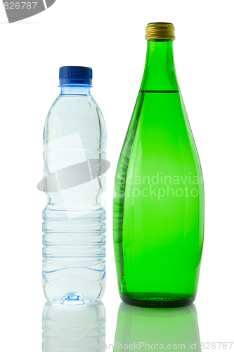 Image of Bottles  of mineral water reflected on white background