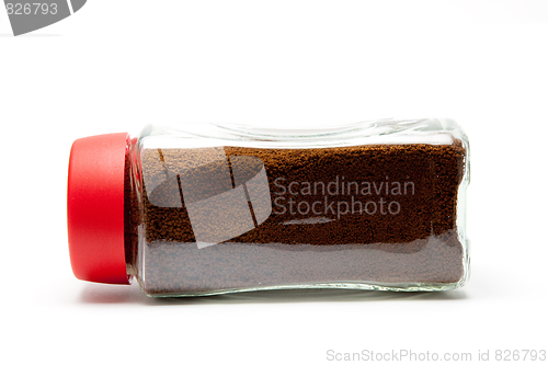 Image of coffee in a glass jar under the white background