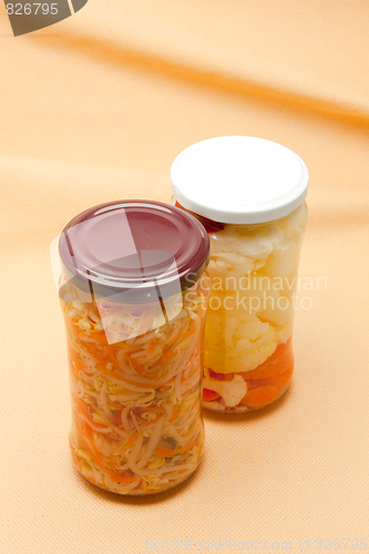 Image of Glass jars with marinated vegetables  isolated on the white back