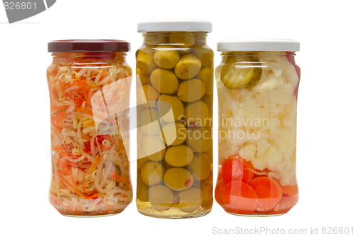 Image of Glass jars with marinated vegetables  isolated on the white back