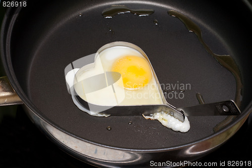 Image of Fried egg in iron form heart