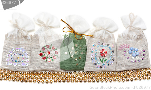 Image of Bags with spice and golden necklace