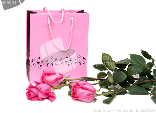 Image of Rose gift package and three roses