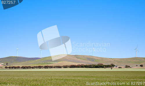 Image of wind turbines along hill