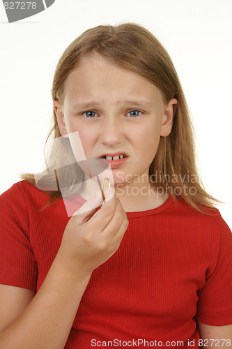 Image of girl taking a pill