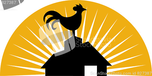 Image of Rooster crowing on top of farm house or barn