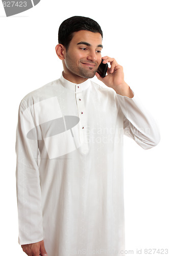 Image of Midldle eastern ethnic man using mobile phone