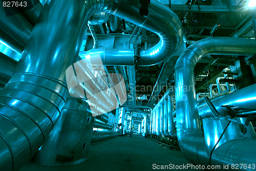 Image of Pipes, tubes, machinery and steam turbine at a power plant
