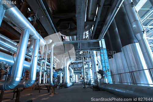 Image of Pipes, tubes, machinery and steam turbine at a power plant
