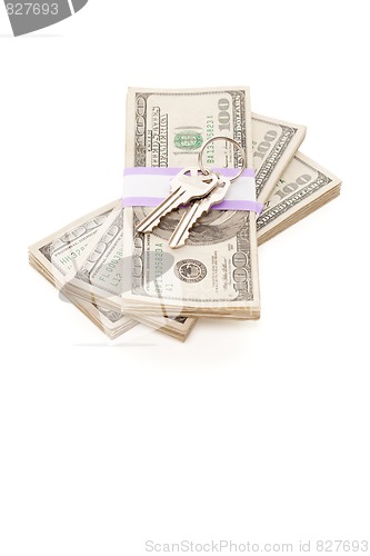 Image of House Keys on Stack of Money Isolated