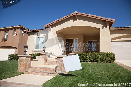 Image of Blank Real Estate Sign and New Home