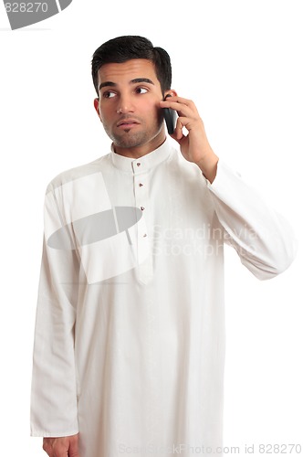 Image of Ethnic businessman on cellphone