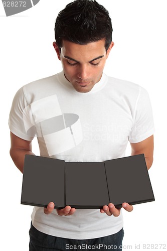 Image of Man showing a set collection of DVD's