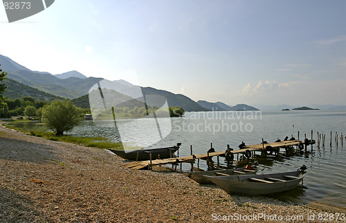 Image of old fishing boats on lake Skarda