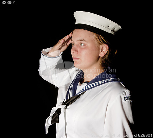 Image of navy seaman saluting on black