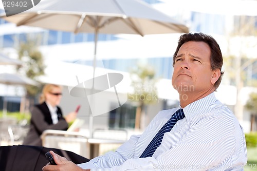 Image of Handsome Businessman Looks Off Into the Distance