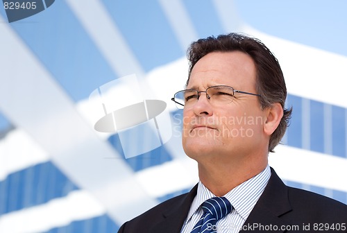 Image of Handsome Businessman Looking Out