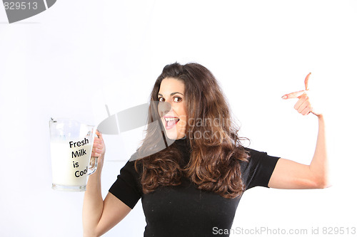 Image of Health conscious young woman with milk