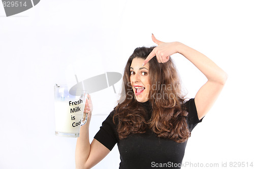 Image of Health conscious young woman with milk