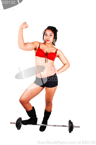 Image of Young girl lifting weight.
